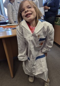 Abbie Hampshire posing in her lab coat