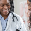 Two healthcare professionals looking at a document.