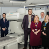 Staff from the Trust and partner organisations posing for a photo alongside the new CT scanner.