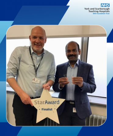 Star Award winner Oli Arikchenin receiving his award from Simon Morritt, Chief Executive