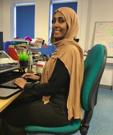 Fatima sat at her desk in an office.