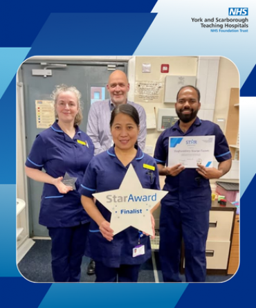 Star Award winners, the Respiratory Nurse Team, receiving their award from Simon Morritt, Chief Executive.