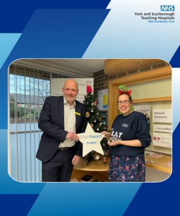 Star Award winner Melanie Hill receiving her award from Simon Morritt, Chief Executive.