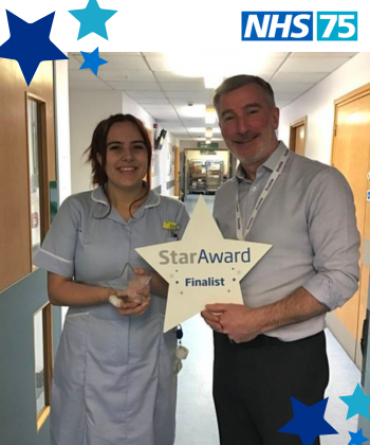 Star Award winner Nerys Pickup receiving her award from Andrew Bertram, Finance Director and Deputy Chief Executive.