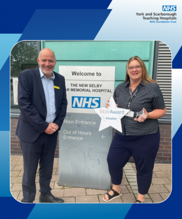 Star Award winner Vicki Fenton receiving her award from Simon Morritt, Chief Executive.