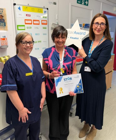 Star Award winner, Angela Rennison, receiving her award from Chief Executive, Clare Smith, and her nominator, Bernadette.