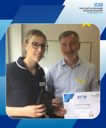 Carly Creasy receiving her Star Award and certificate from Andrew Bertram, Finance Director