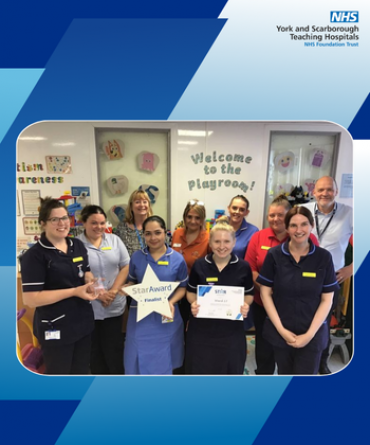 Staff from Ward 17 receiving their Star Award and certificate from Simon Morritt, Chief Executive