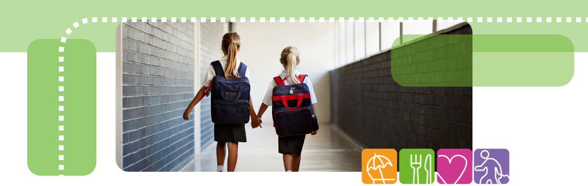 Image of two children walking down corridor holding hands with back to camera