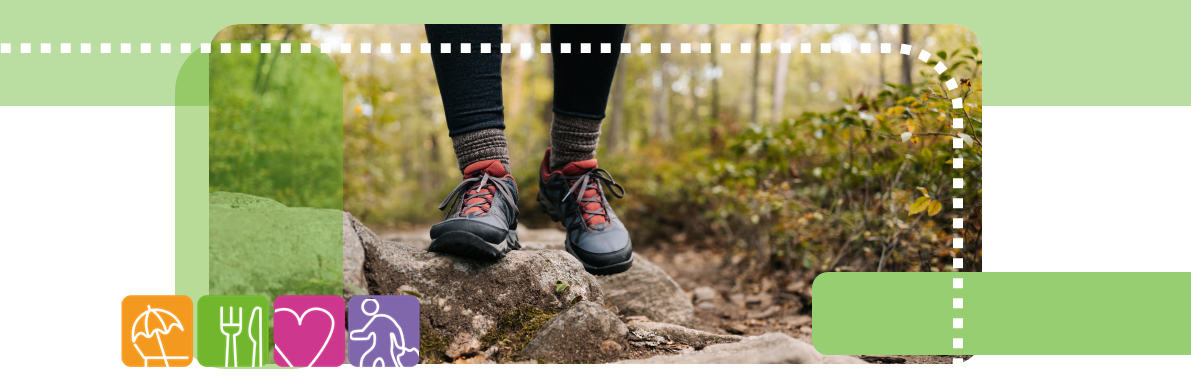 Image of two feet wearing trainers in the woods