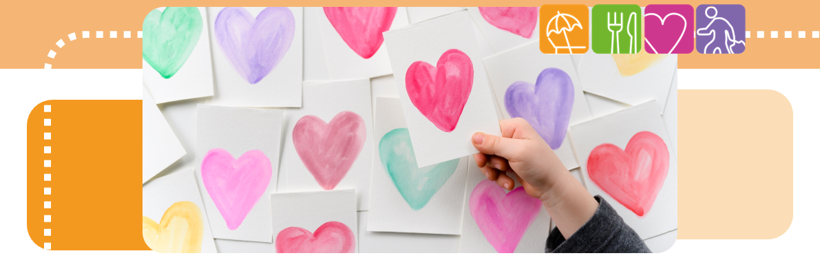 Image of loads of hand drawn hearts on card in the background, with a hand holding a heart in the foreground