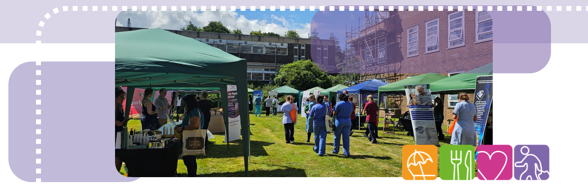 Image of scarborough staff benefits summer fair looking between rows of gazebos