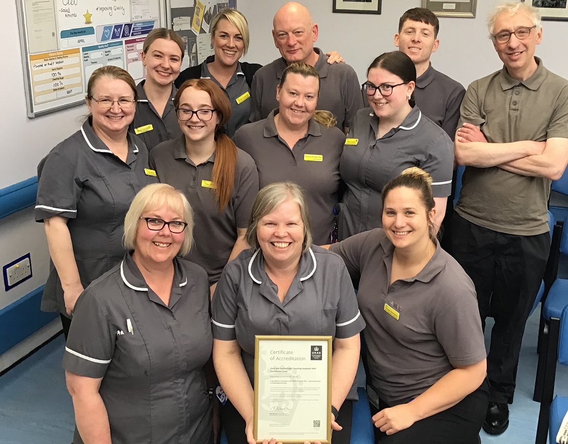 Group photo of the audiology team with their award.